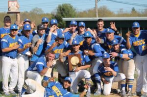 NECC baseball players pose with trophy