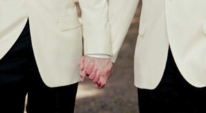 gay-grooms-hold-hands-Allegro-Photography