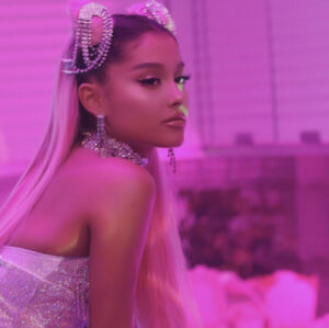 Photo of Ariana Grande with purple lighting 