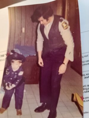Deputy Bailey at three years old with his uncle who worked with the Amesbury Police Department