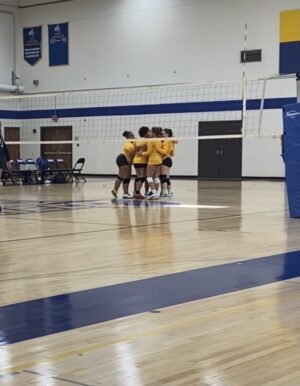 NECC Knights volleyball team celebrates after winning a set in a game against Mass Bay Community College Oct. 16. 