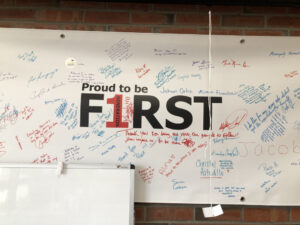 A sign that says Proud to be First
