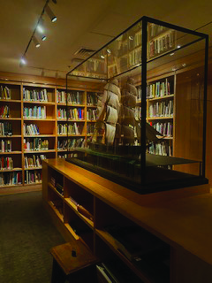 A model ship in a glass case in the Addison Gallery library is shown/