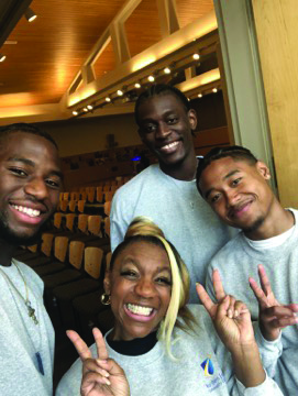 Four students take a selfie together at the fall semester convocation in the Tech Center on Sept. 5.