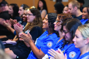 Students in the audience in the Tech Center during convocation on Sept. 5 applaud a speaker.