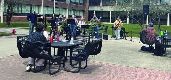 Students play music in the quad on the Haverhill campus.