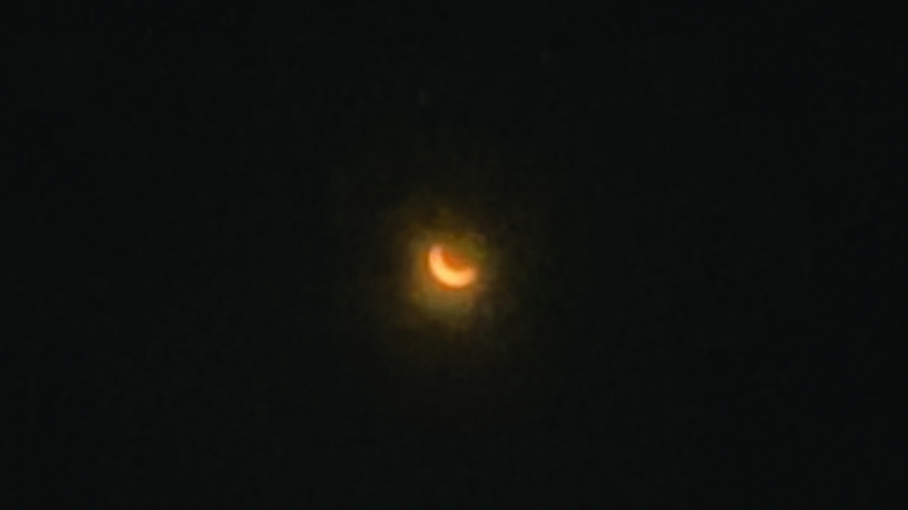 The eclipse is seen from NECC’s Haverhill campus on April 8.