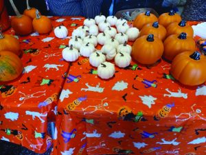 Orange and white pumpkins on a table in the Spurk lobby.