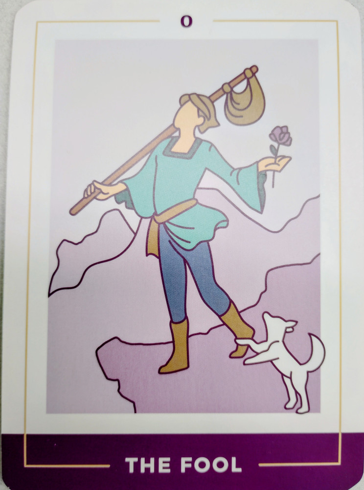 A Tarot card showing "The Fool" a man with a small white dog at his foot.