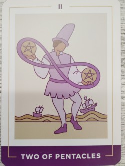 Tarot card showing the two of pentacles