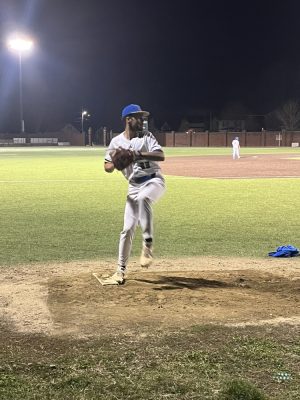 NECC baseball player practices before the game against Bunker Hill.