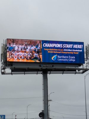 A billboard on Interstate 495 showcasing the NECC’s 2026 Men’s Basketball Team Nationals Championship