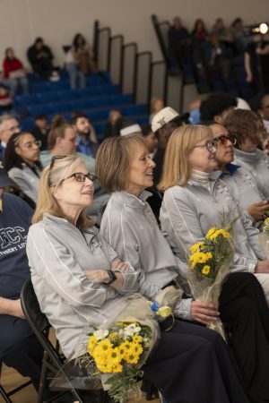 Crowds of people at the NECC gym celebrating the team's accomplishment